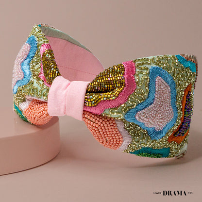 Fita de cabelo com nó de primavera