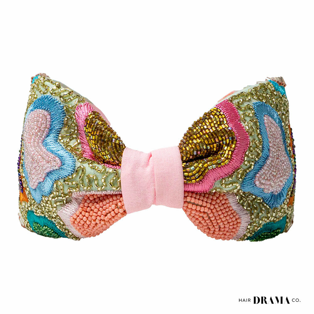 Fita de cabelo com nó de primavera