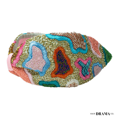 Fita de cabelo com nó de primavera