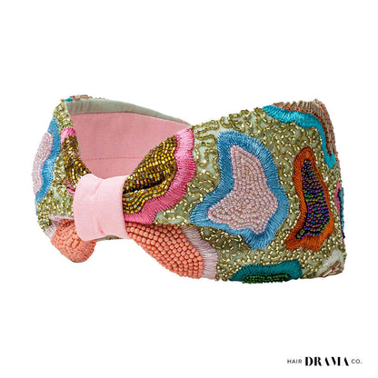 Fita de cabelo com nó de primavera