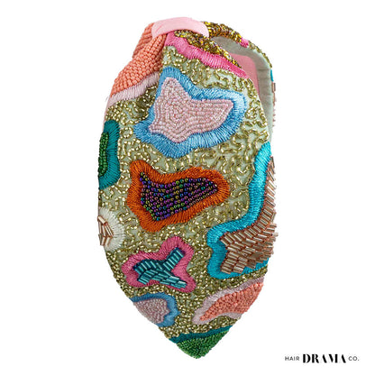 Fita de cabelo com nó de primavera