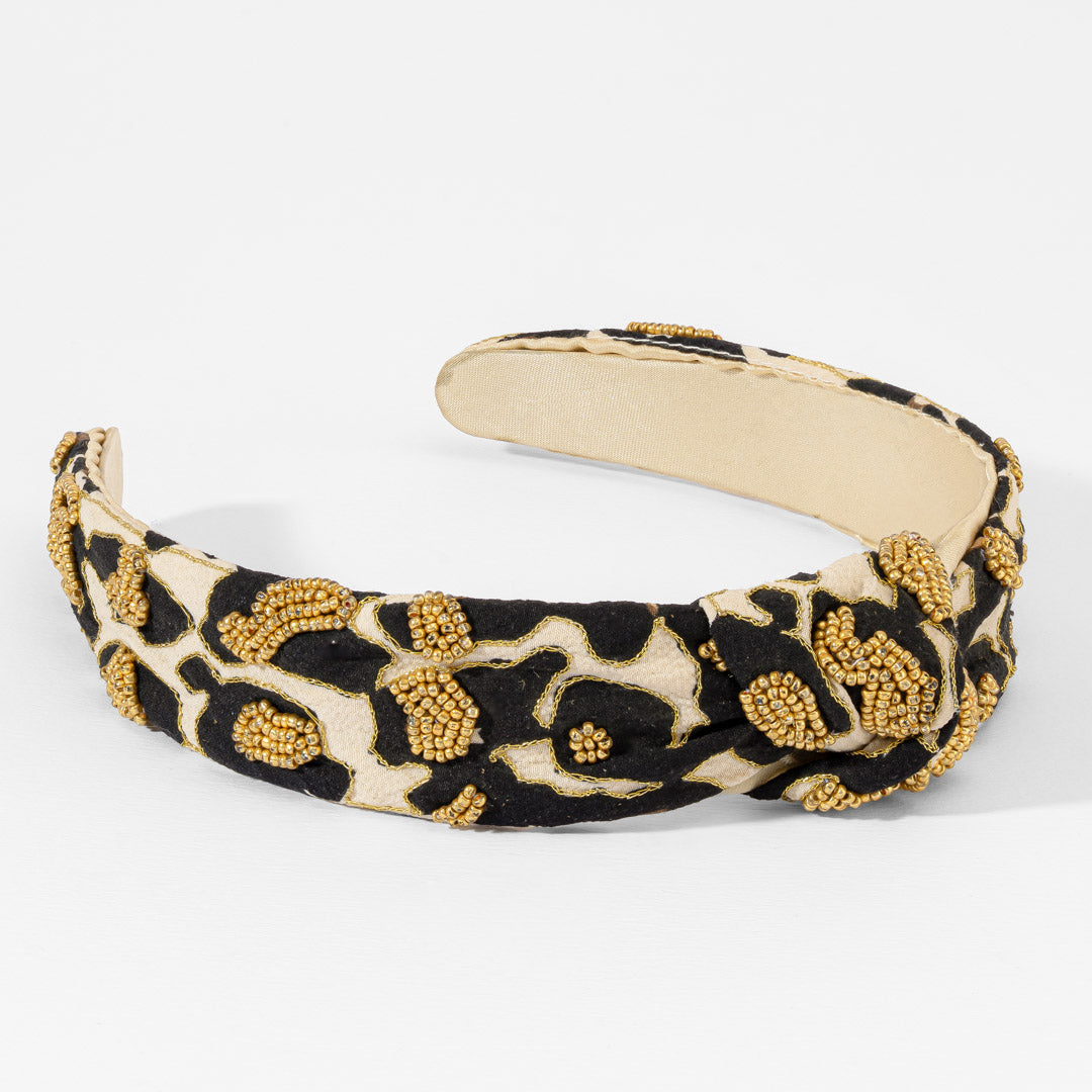 Fita de cabelo com nó e padrão leopardo