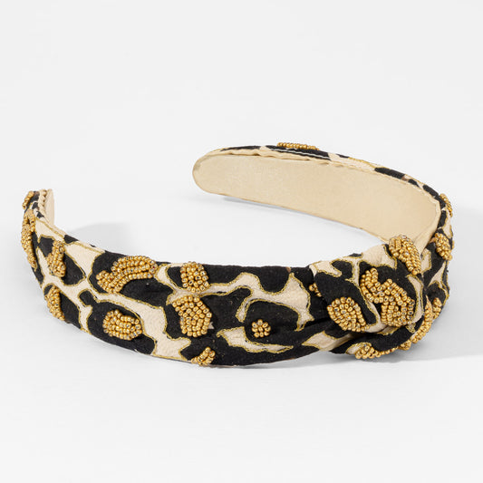 Fita de cabelo com nó e padrão leopardo