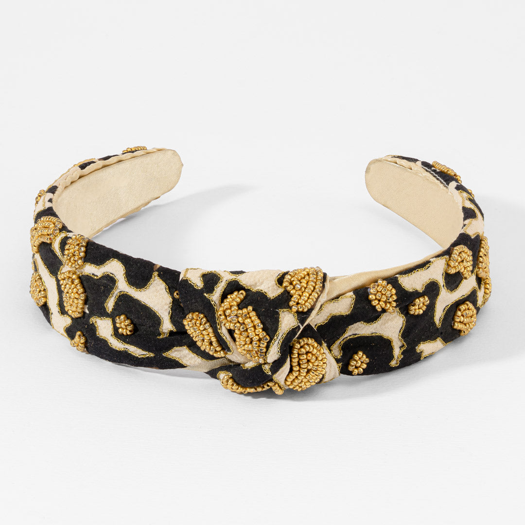 Fita de cabelo com nó e padrão leopardo