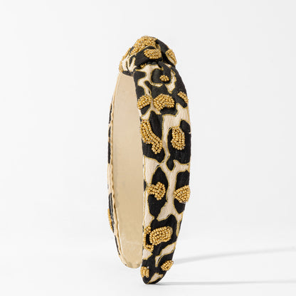 Fita de cabelo com nó e padrão leopardo