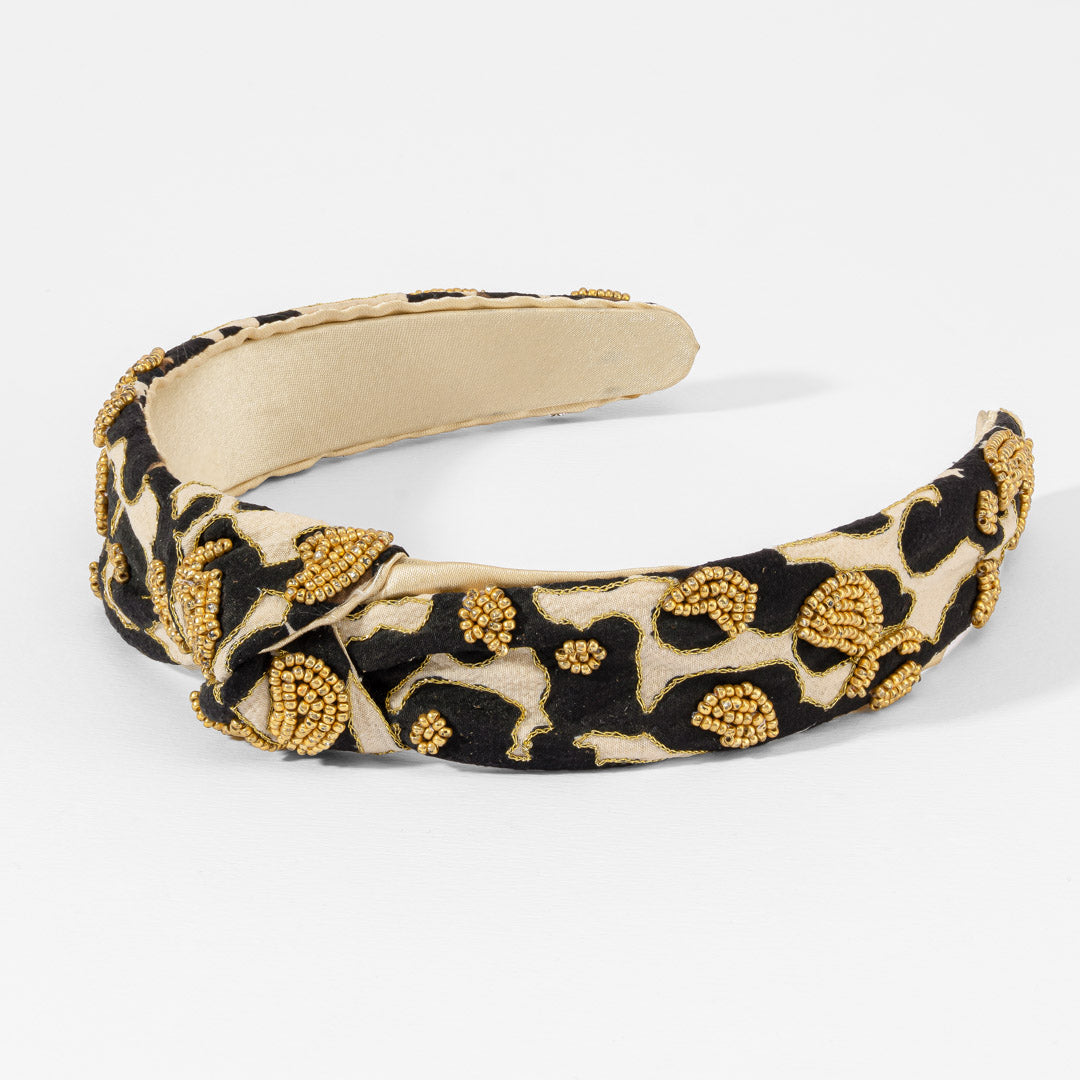 Fita de cabelo com nó e padrão leopardo