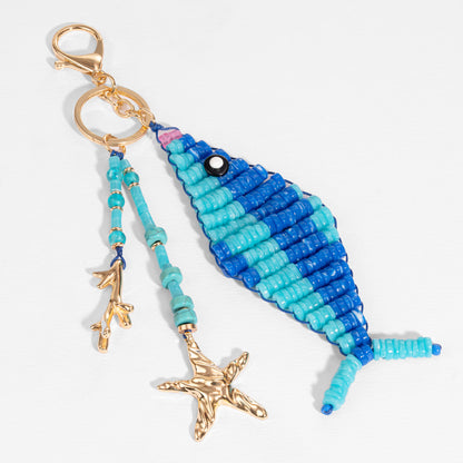 Pendente de bolsa em forma de peixe Dory com missangas